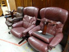 Two burgundy leather swivel armchairs with matching footstool together with a brown leather office