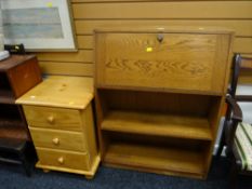 A vintage oak narrow bureau with bookcase base together with a small pine three-drawer chest /