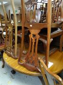 An antique mahogany extending dining table on ball & claw supports + four matching Chippendale-style