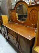An Edwardian mahogany circular mirror backed sideboard with inlaid decoration, three drawers flanked