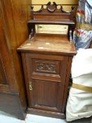 Early twentieth century mahogany carved door night cabinet with mirror & shelf back