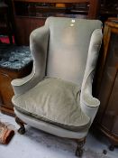 A good Queen Anne-style wingback armchair with ball & claw feet circa 1900