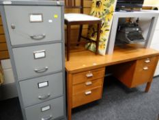 A vintage gold & key light mahogany office-style kneehole desk together with a metal four-drawer