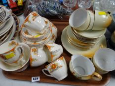 Tray of various patterned teaware