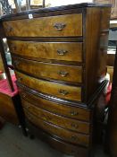 A reproduction Queen Anne-style mahogany bow fronted chest-on-chest