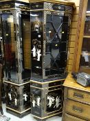 A modern black lacquer & gold decorated standing corner cabinet with glazed door top & cupboard