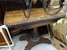 An early nineteenth century rosewood foldover card table with acanthus leaf carved decoration,