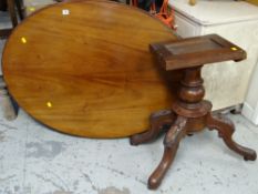 A vintage mahogany oval tilt-top breakfast table
