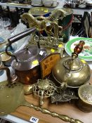 A tray of various metalware including brass door stops, copper kettle etc
