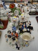 Collection of various Staffordshire flat backs together with a pair of Staffordshire dogs