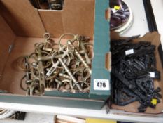 A collection of various horse bits & metal door hinges