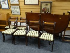 Reproduction mahogany extending D-end dining table with six (4+2) matching chairs