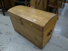 A good vintage dome topped pine chest with cast metal carry handles