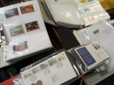 A large parcel of First Day Covers & folders of loose foreign stamps