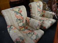 Two early twentieth century scroll back armchairs in a floral upholstery