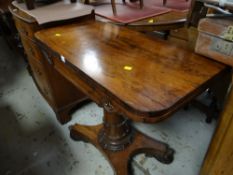 An antique rosewood foldover card table on a single column support