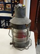 A grey metal & glass mast headlight