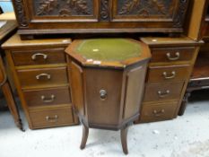 A pair of vintage mahogany four-drawer bedside cabinets together with an octagonal topped lion