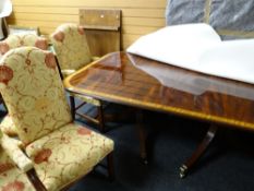 A good quality reproduction mahogany twin-pedestal extending dining table with banding decoration