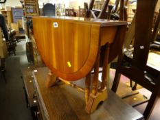 A small yew wood drop leaf side table