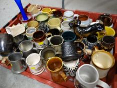 A crate of various metal & ceramic tankards