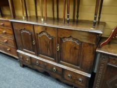 Antique oak three-door & three-drawer cupboard height - 95cms, depth -54cms, length - 142cms