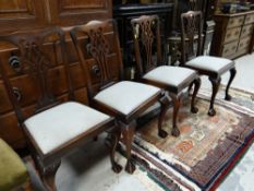 A set of four mahogany ball & claw Chippendale style dining chairs with drop in seats