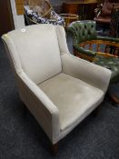 A vintage grey velour club chair