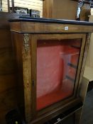 An antique marquetry and gilt-metal decorated single-door pier-cabinet