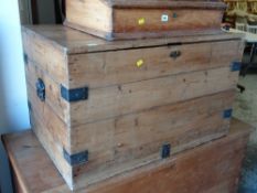 A large pine trunk with metal banding & carry handles