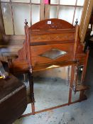 A carved Edwardian mahogany shelved overmantel mirror