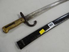 A large curved bayonet and scabbard