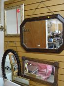 A vintage beaded oak octagonal bevelled wall mirror, carved mahogany oval bevelled wall mirror & two