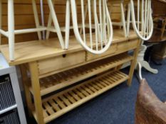 A pine narrow kitchen table with three drawers & two shelves. Height - 89cm's, depth - 42cm's,