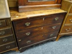 An ntique mahogany three-drawer chest of drawers with mother-of-pearl with ivory escutcheons to
