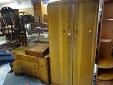 A vintage oak effect two-door wardrobe together with a matching mirrored dressing table