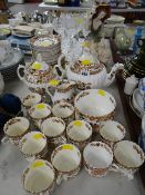 Early twentieth century floral & gilt decorated teaset together with a figurine of a seated female &