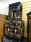 A small lacquered gold painted with relief decoration single drawer & two-door cupboard cabinet