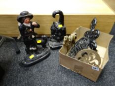 Two cast metal door stops, brass trivet etc