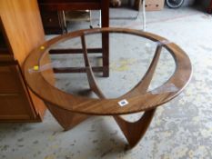 A vintage G-plan circular glass topped coffee table