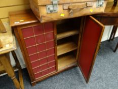 A small reproduction brass decorated two-door cabinet