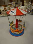 Vintage tin model fairground ride
