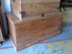 A large pine trunk with brass handles