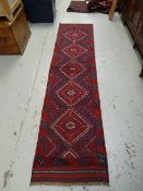 A mainly blue & red patterned Meshwari runner, 252 x 60cms