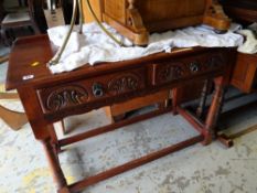 An Old Charm dark oak two-drawer console table