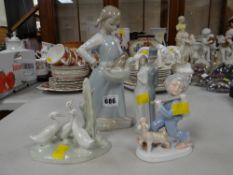 Two Nao figures together with two other similar