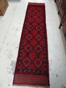 A Meshwari runner, mainly blue & red patterned, 251 x 60cms