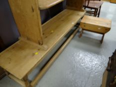 A long narrow pine coffee table together with a small pine stool. Length - 166cms, height -35cms,