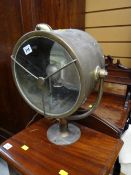 A brass circular ship's spotlight E/T
