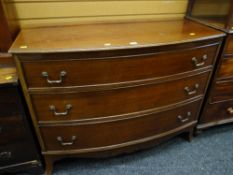 A reproduction mahogany bow fronted three-drawer chest of drawers. Height - 92cms, depth - 56cms,